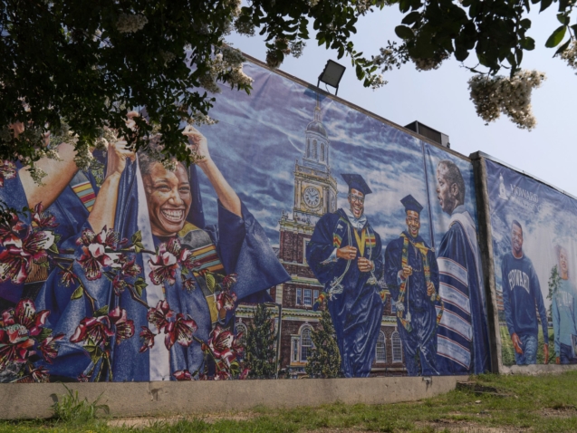 FILE - A graduation themed printed mural is seen on the Howard University campus, July 6, 2021, in Washington. More than a third of America’s 101 historically Black colleges and universities have been targeted by calls or emails threatening bombings since early January. Howard University in Washington has received at least four threats since Jan. 4. (AP Photo/Jacquelyn Martin)