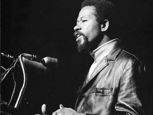 Eldridge Cleaver, Black Panther party minister of information and the party's nominee for president of the United States, appears at Stanford University Memorial Auditorium as he delivers a lecture to more than 1,700 students and spectators on Oct. 2, 1968.  (AP Photo)