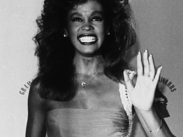 Singer Whitney Houston accepts her Grammy Award on Tuesday, Feb. 25, 1986 in Los Angeles for pop female vocal performance with ?Saving All My Love For You.? Miss Houston was snubbed for the award as best new artist. (AP Photo)
