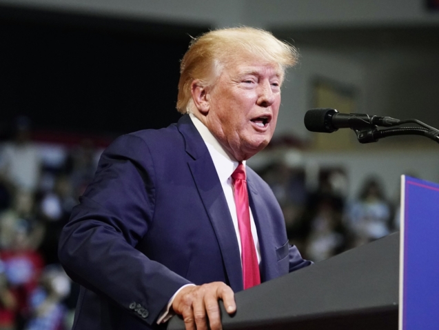 FILE - Former President Donald Trump speaks at a Save America rally Friday, July 22, 2022, in Prescott, Ariz. An AP-NORC in June found that 48% of U.S. adults say Trump should be charged with a crime for his role in the siege of the U.S. Capitol. January’s AP-NORC poll showed that people were just as down on Trump running again in 2024 as they were Biden: Just 27% of U.S. adults wanted Trump to run again, including a slim majority, 56% of Republicans. (AP Photo/Ross D. Franklin, File)