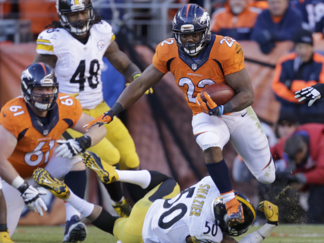 FILE - Denver Broncos running back Ronnie Hillman (23) runs over Pittsburgh Steelers inside linebacker Ryan Shazier during the first half in an NFL football divisional playoff game, Sunday, Jan. 17, 2016, in Denver. Hillman, who was part of the Denver Broncos team that won Super Bowl 50, has died, his family said in a statement. He was 31. Hillman's family posted on his Instagram account Wednesday, Dec. 21, 2022, that he was diagnosed in August with a rare form of kidney cancer called renal medullary carcinoma and was under hospice care. The family wrote hours later that he died surrounded by family and close friends. (AP Photo/Joe Mahoney, File)