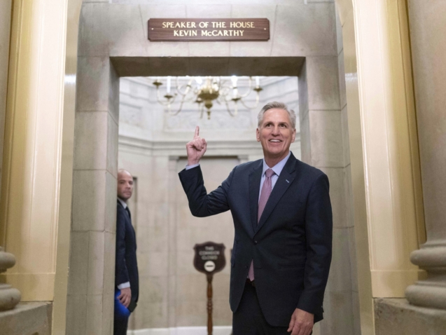 Speaker of the House Kevin McCarthy of Calif., points to the newly installed nameplate at his office after he was sworn in as speaker of the 118th Congress in Washington, early Saturday, Jan. 7, 2023. (AP Photo/Jose Luis Magana)