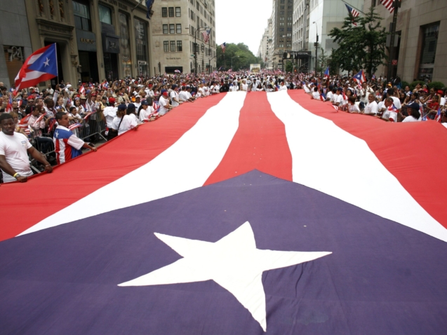 A large Puerto Rican flag is carried up Fifth Avenue during the Puerto Rican Day Parade Sunday, June 13, 2010 in New York. (AP Photo/Jason DeCrow)
