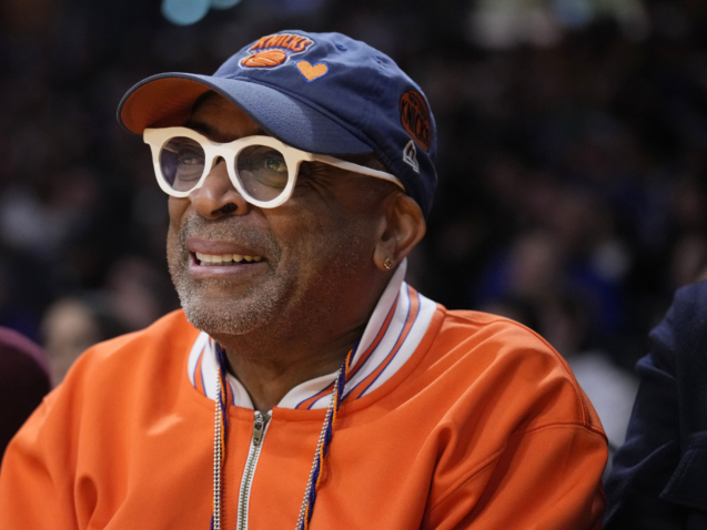 Director Spike Lee smiles during the first half of an NBA basketball game between the Los Angeles Lakers and the New York Knicks Sunday, March 12, 2023, in Los Angeles. (AP Photo/Marcio Jose Sanchez)