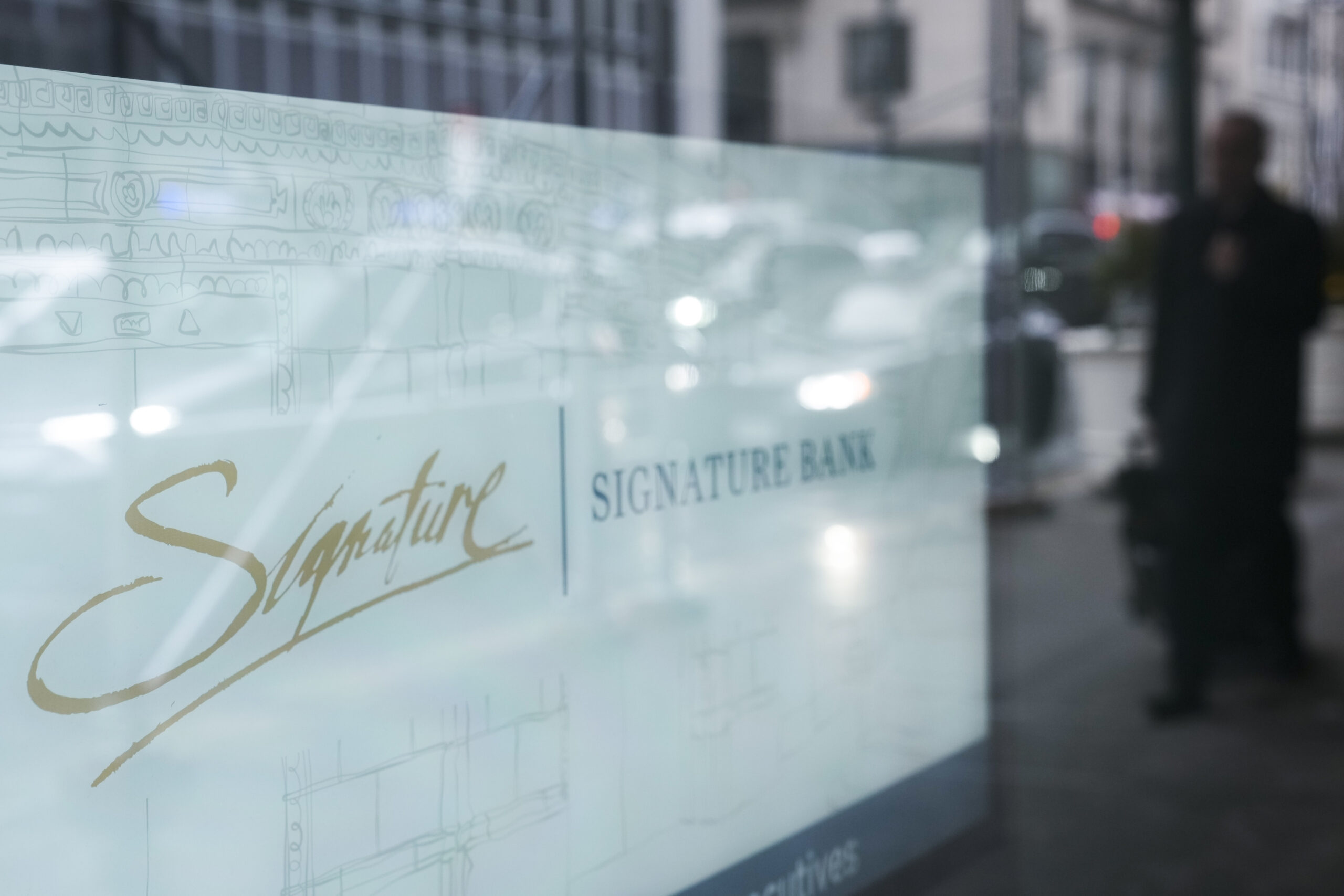 A sign is displayed at a branch of Signature Bank in New York