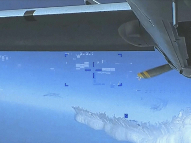This photo taken from video released by the US Department of Defense on Thursday, March 16, 2023, shows a Russian Su-27 exhaust, after the jet approached the back of the MQ-9 drone over the Black Sea. The Pentagon has released footage of what it says is a Russian aircraft conducting an unsafe intercept of a U.S. Air Force surveillance drone in international airspace over the Black Sea. (US Department of Defense via AP)