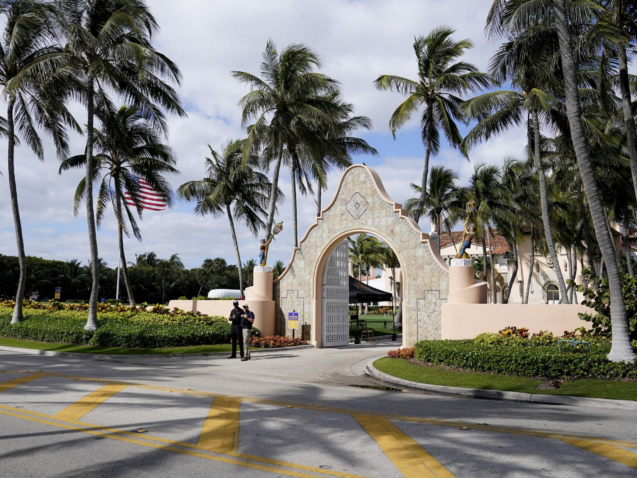 Security guards work outside of former President Donald Trump's Mar-a-Lago estate, Friday, March 17, 2023, in Palm Beach, Fla. Trump said in a social media post that he expects to be arrested Tuesday as a New York prosecutor is eyeing charges in a case examining hush money paid to women who alleged sexual encounters with the former president. Trump provided no evidence that suggested he was directly informed of a pending arrest and did not say how he knew of such plans. (AP Photo/Lynne Sladky)