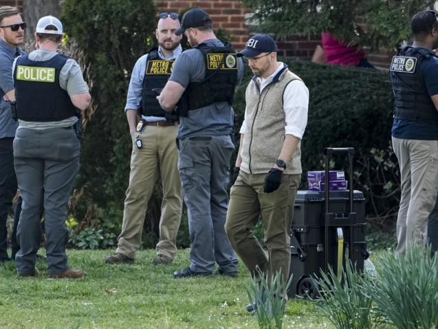 Authorities investigate a home possibly connected to the school shooting in Nashville, Monday, March 27, 2023, in Nashville, Tenn. Nashville police identified the victims in the private Christian school shooting Monday as three 9-year-old students and three adults in their 60s, including the head of the school. (AP Photo/John Bazemore)
