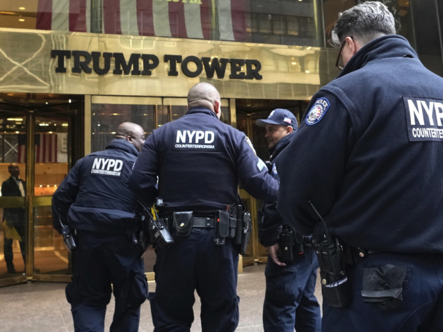 Several members of the NYPD enter Trump Tower on Friday, March 31, 2023, in New York. Former President Donald Trump was indicted by a Manhattan grand jury, Thursday, a historic reckoning after years of investigations into his personal, political and business dealings and an abrupt jolt to his bid to retake the White House. (AP Photo/Bryan Woolston)