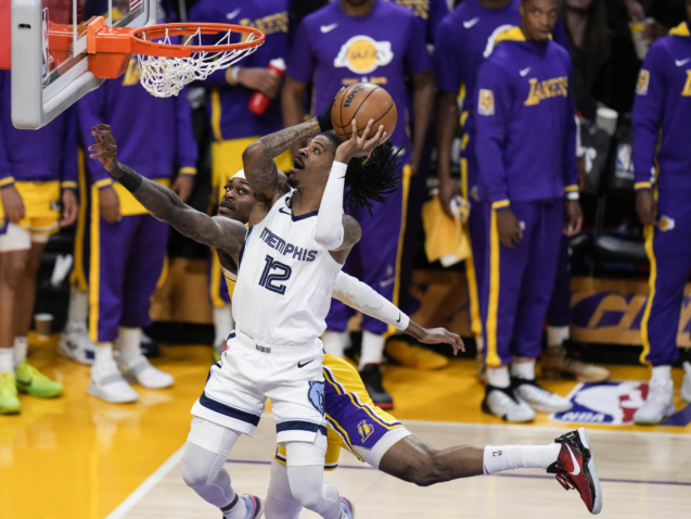 Memphis Grizzlies' Ja Morant (12) drives to the basket against Los Angeles Lakers' Jarred Vanderbilt during the first half in Game 6 of a first-round NBA basketball playoff series Friday, April 28, 2023, in Los Angeles. (AP Photo/Jae C. Hong)