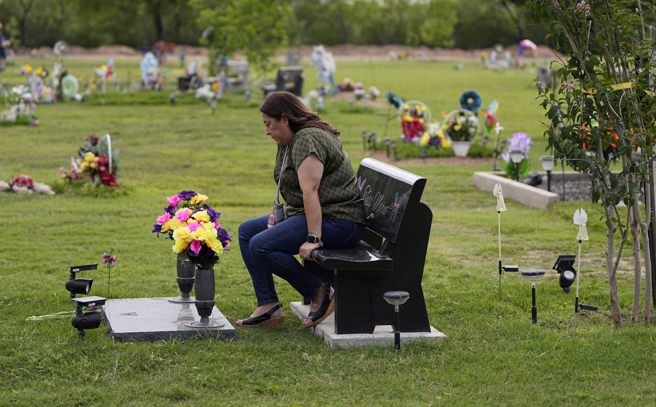 Veronica Mata visits the gravesite of her daugher, Tess, in Uvalde, Texas, Wednesday, May 3, 2023.