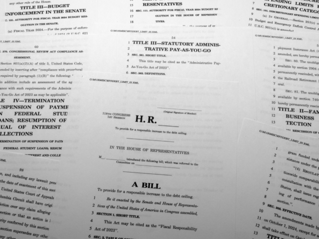 The draft of a bill that President Joe Biden and House Speaker Kevin McCarthy of Calif., negotiated to raise the nation's debt ceiling, is photographed Monday, May 29, 2023. (AP Photo/Jon Elswick)