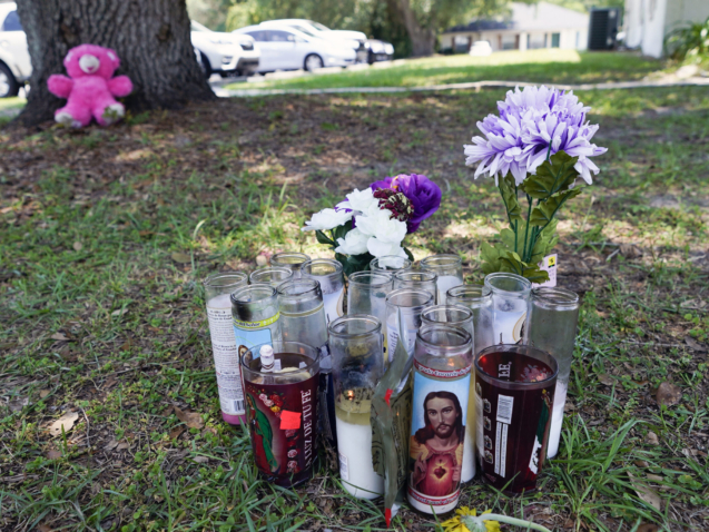 A small memorial is seen outside an apartment, Tuesday, June 6, 2023, in Ocala, Fla., where Ajike Owens, a 35-year-old mother of four was killed in a Friday night, June 2, shooting that Marion County Sheriff Billy Woods said was the culmination of a 2½-year feud between neighbors. Authorities came under intense pressure Tuesday to bring charges against a white woman who killed Owens, a Black neighbor on her front doorstep, as they navigated Florida’s divisive stand your ground law that provides considerable leeway to the suspect in making a claim of self defense. (AP Photo/John Raoux)