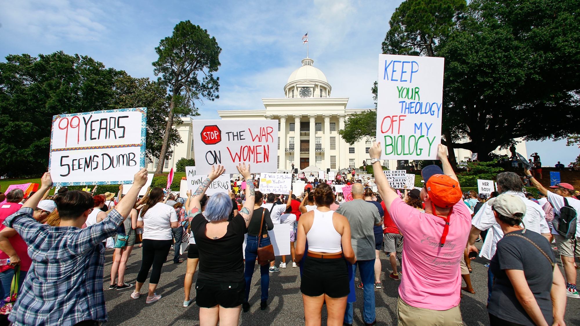 Protesters for women's rights hold a rally on the Alabama Capitol steps to protest a law passed the week before making abortion a felony in nearly all cases with no exceptions for cases of rape or incest, Sunday, May 19, 2019, in Montgomery, Ala. (AP Photo/Butch Dill, File)