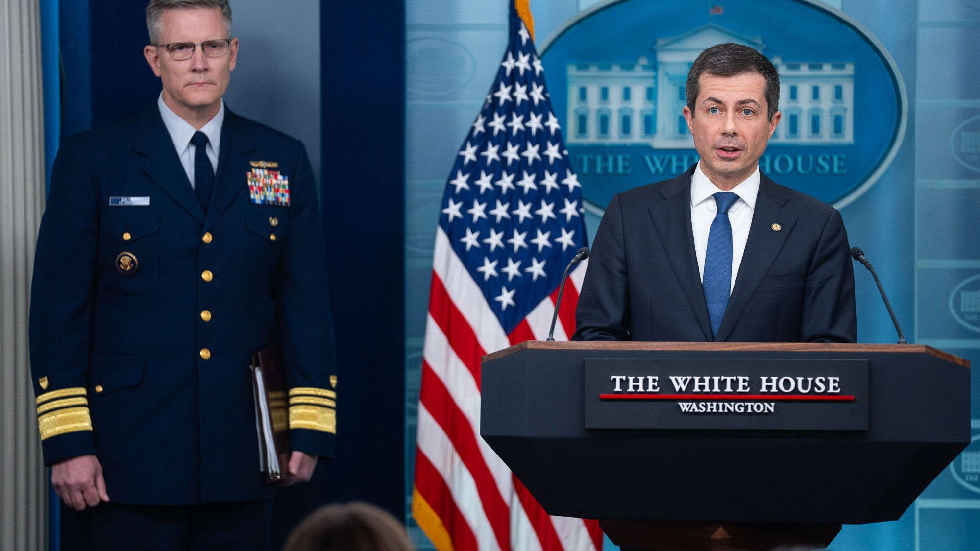 Coast Guard Deputy Commandant for Operations Vice Admiral Peter Gautier listens as Transportation Secretary Pete Buttigieg speaks about the Francis Scott Key Bridge collapse during a press briefing at the White House, Wednesday, March 27, 2024, in Washington. (AP Photo/Evan Vucci)
